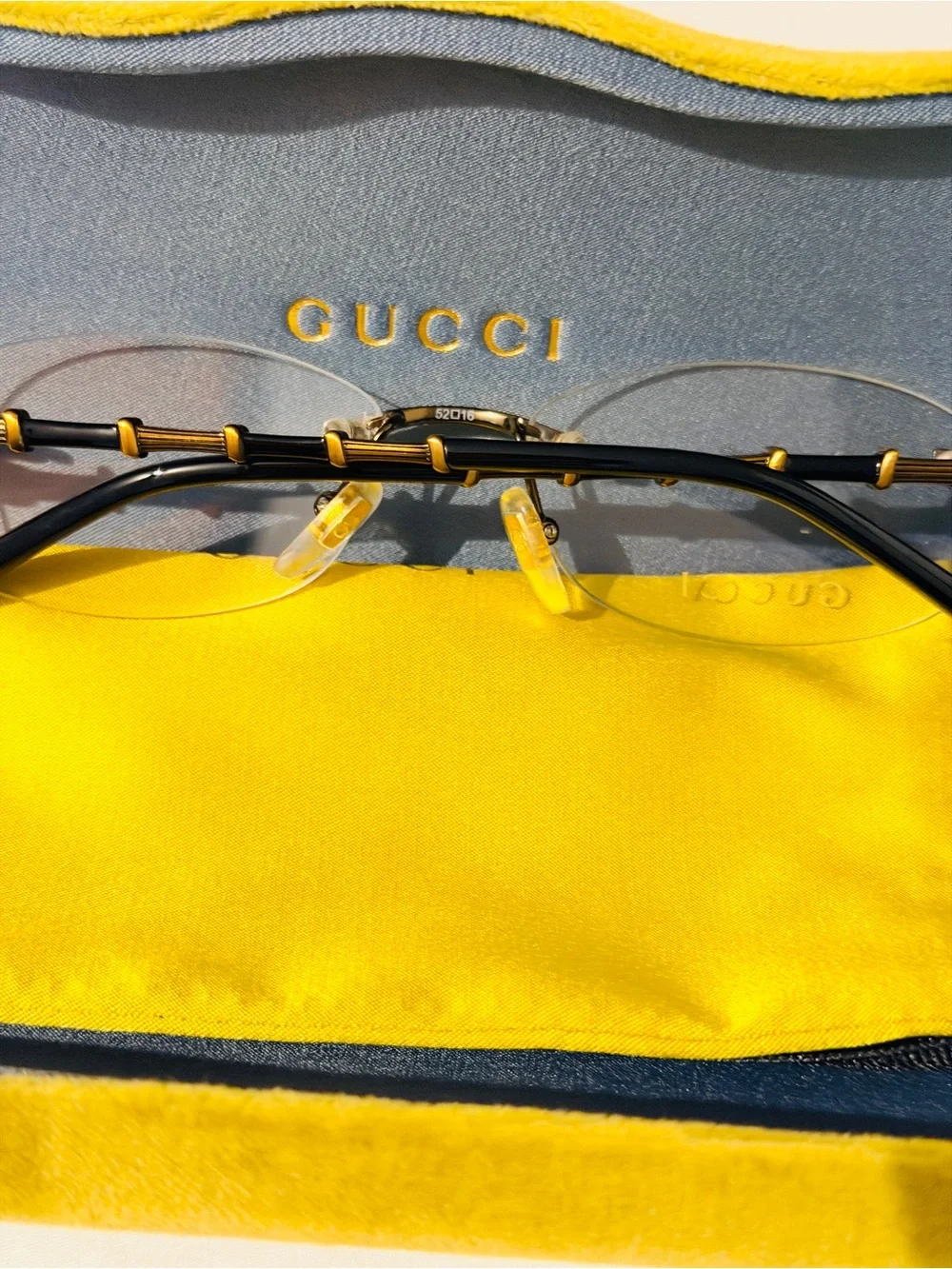 Gucci Rimless Men's Glasses in Black and Gold Accents